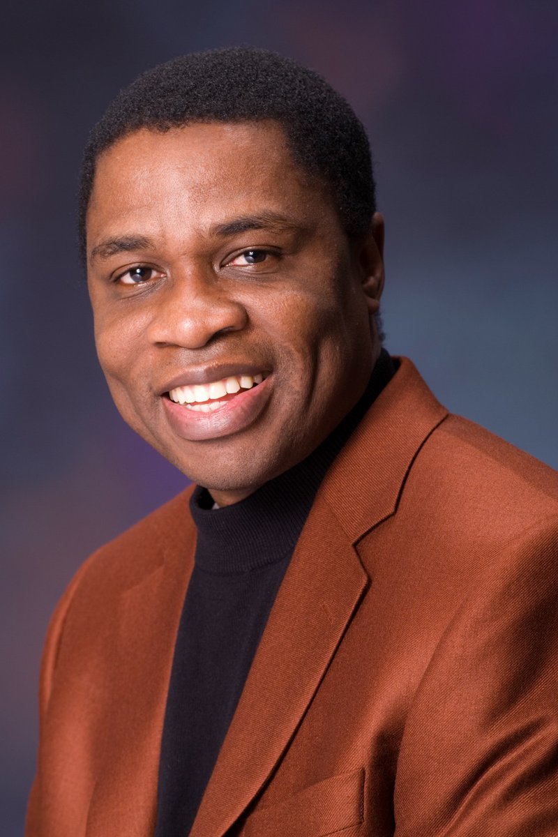Dr. Henry Ukpeh smiling in a portrait
