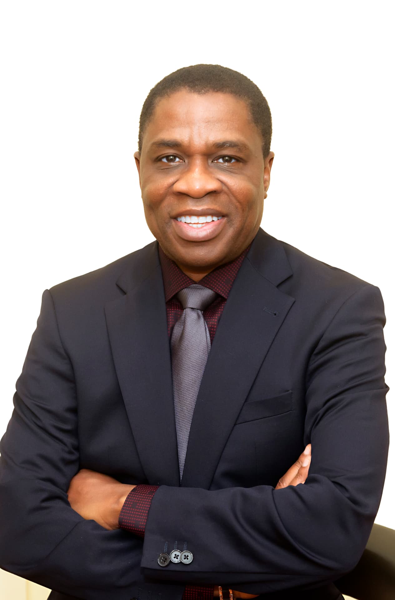 Dr. Henry Ukpeh in a dark suit